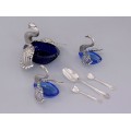 Garnitură pentru condimente din argint și sticlă cobalt formată din trei boluri stilizate sub forma unor lebede și trei lingurițe