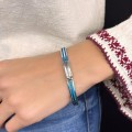 Brățară bangle unisex de perioadă mid-century decorată cu intarsii de email albastru - turcoaz | cca. 1970