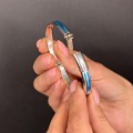 Brățară bangle unisex de perioadă mid-century decorată cu intarsii de email albastru - turcoaz | cca. 1970