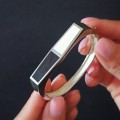 Brățară bangle mid-century manufacturată în argint decorată cu lemn de abanos și fildeș | Statele Unite cca.1970