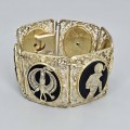 Opulentă brățară Art Deco Egyptian Revival din argint aurit și email negru | cca. 1930