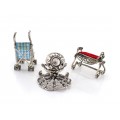 Colecție de miniaturi din argint: Simboluri ale copilăriei și maternității 