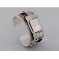 Impresionantă brățară amerindiană cu ceas | manufactură în argint & onix negru natural | artizan navajo Tom Billie | Statele Unite cca. 1980